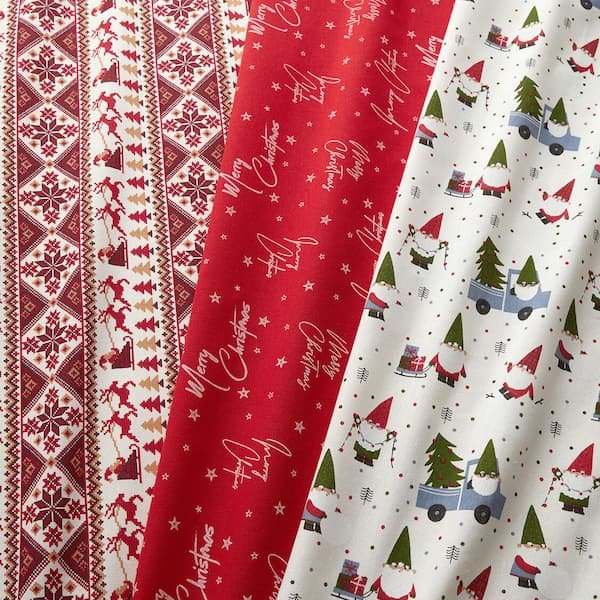 Tessuto per Tovaglia di Natale fai da te realizzata con tessuto cotone rosso e decorazioni oro, perfetta per tavola festiva.